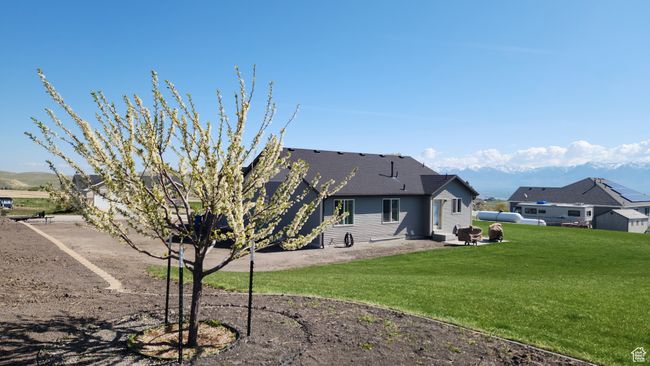 Back of property featuring a lawn and a patio area | Image 26