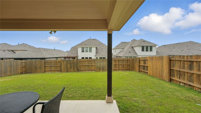 Fenced backyard featuring a patio and a residential view | Image 33