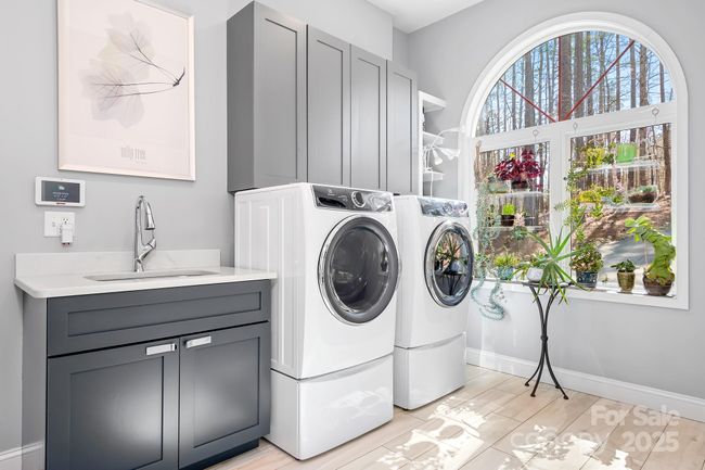 Laundry Room with custom cabinetry, huge windo and custom drop zone not pictured. | Image 36