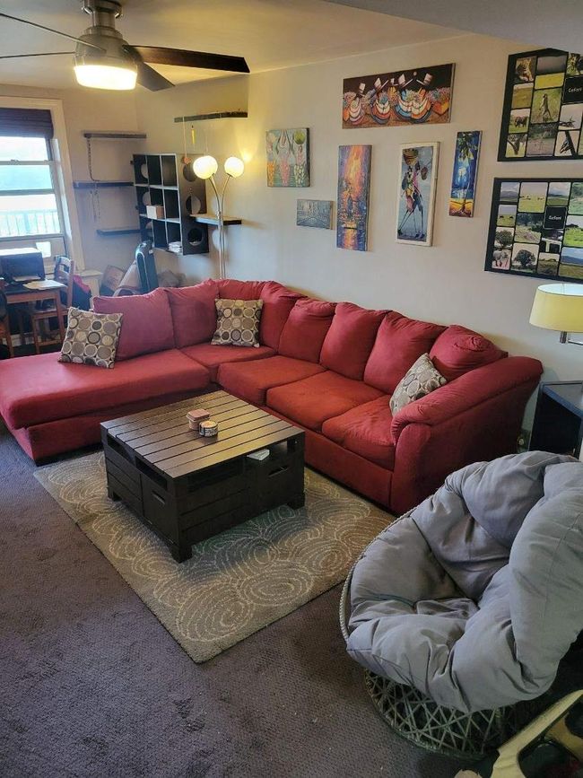 Living room featuring carpet flooring and ceiling fan | Image 6