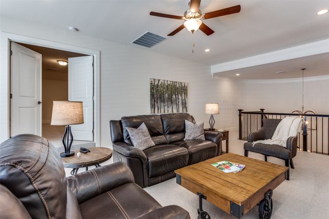 Living area featuring light colored carpet, a ceiling fan, recessed lighting, and crown molding | Image 26