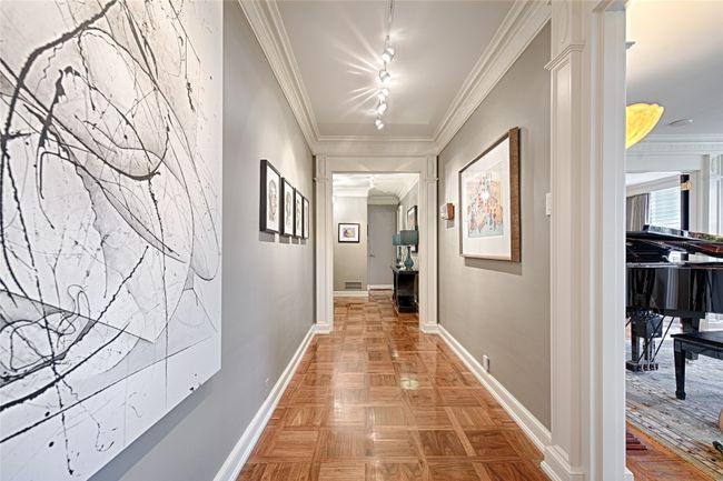 Gallery looking towards the entry foyer featuring crown molding and track lighting | Image 22
