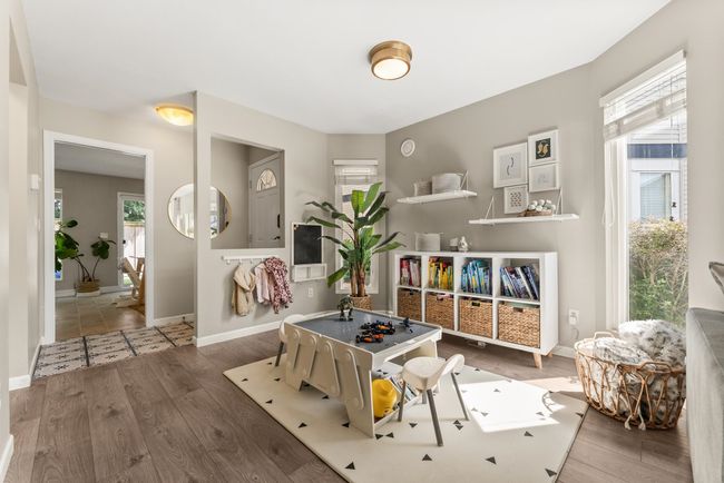 Sitting room with healthy amount of natural light, wood finished floors, and baseboards | Image 14