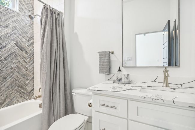 Full bathroom with vanity and shower / bath combo with shower curtain | Image 33