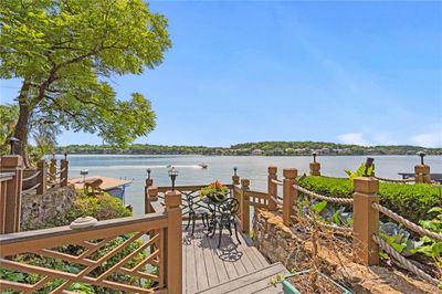 Lakefront, yet private pool and entertaining areas. | Image 1