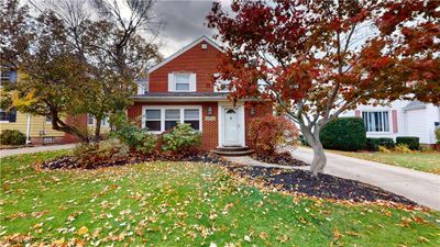 View of front property with a front lawn | Image 1