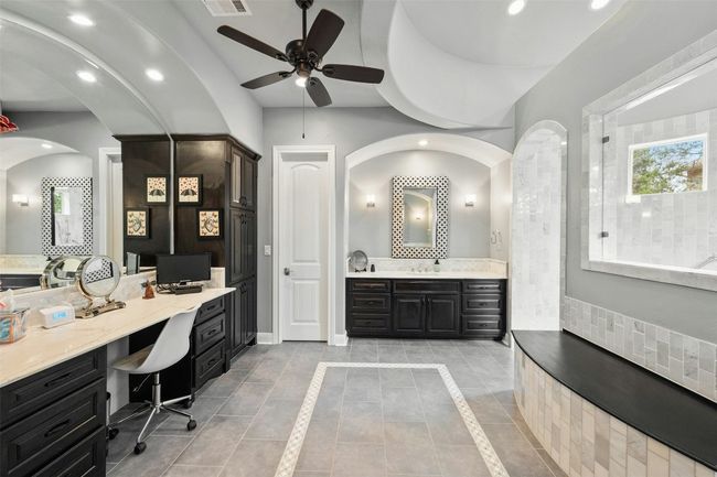 Primary bathroom has so much cabinet storage as well as counter space. | Image 25
