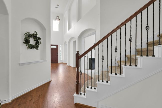 View from the base of the staircase, showcasing a foyer that feels truly royal. Let's head upstairs! | Image 23