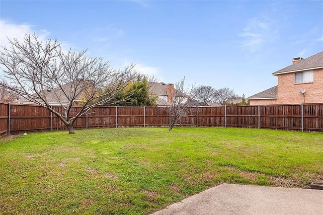 View of yard with a fenced backyard | Image 24