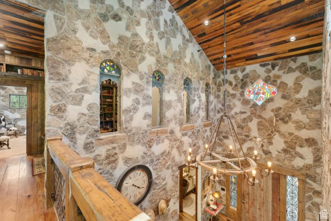 Detailed view of wood ceiling, a chandelier, and wood finished floors | Image 25