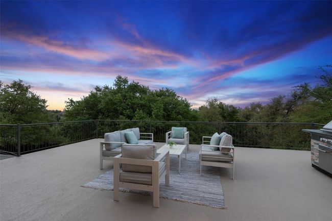 Patio terrace at dusk with an outdoor living space | Image 28