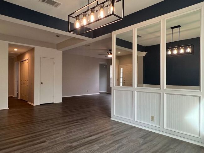 Spare room featuring dark wood-style flooring, ceiling fan, and recessed lighting | Image 9