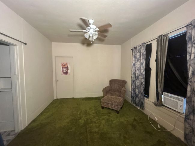 Unfurnished room with carpet and ceiling fan | Image 5