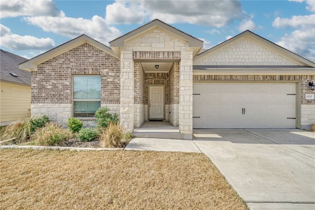 View of front of property featuring a garage | Image 4