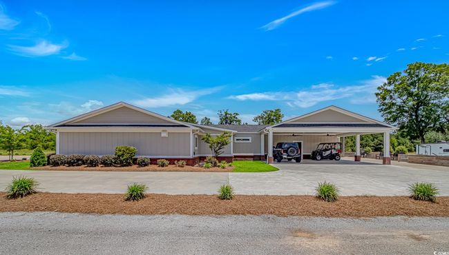View of front of property with a carport and concrete driveway | Image 29
