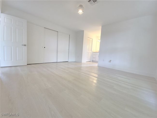 Unfurnished bedroom with a closet, light wood-type flooring, and baseboards | Image 28