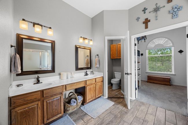 Dual Vanities and wood-like tile floor | Image 25