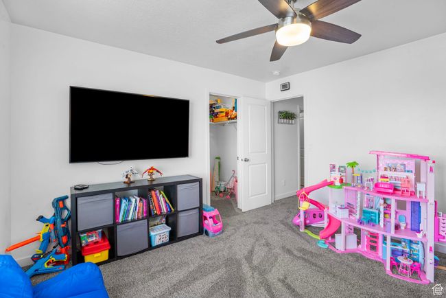 Rec room featuring carpet and a ceiling fan | Image 19