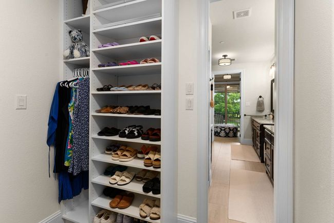 Custom closet with shelving cabinets and drawers. | Image 24