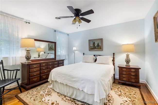 Bedroom featuring wood finished floors and a ceiling fan | Image 30