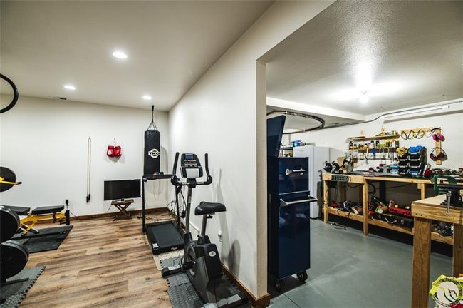 Hobby room/utility also has a separate access to the garage for easy access to your toys upstairs | Image 30