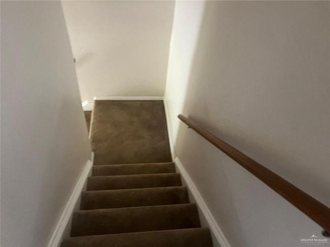 Stairs featuring carpet flooring and baseboards | Image 4