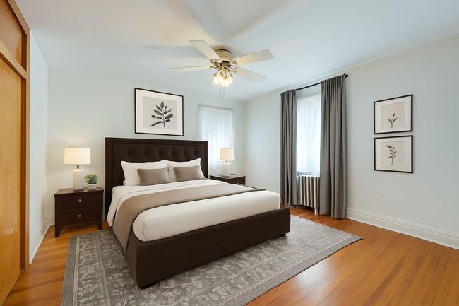 Bedroom featuring wood finished floors and a ceiling fan | Image 25
