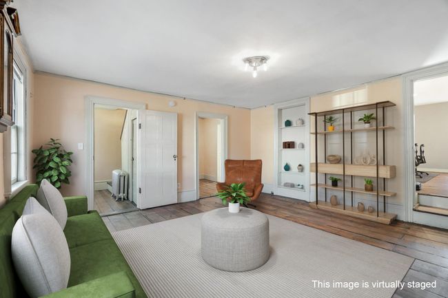 First floor space with fireplace, could be an office or retail. Yes, wide plank Hickory flooring. | Image 7
