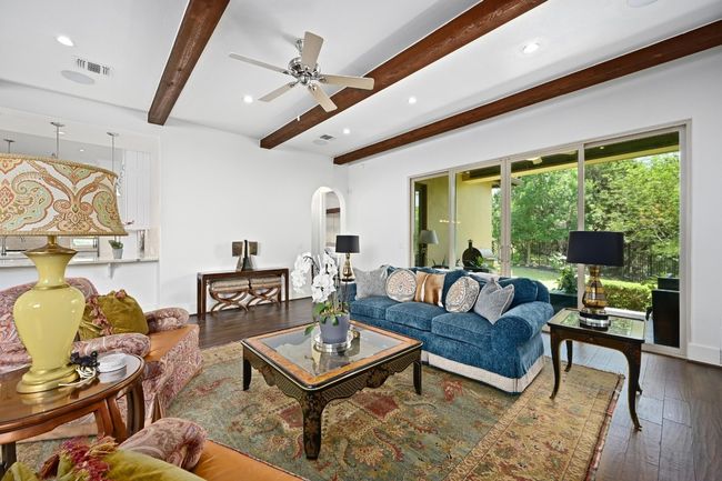 Living room featuring beam ceiling, hardwood floors | Image 6