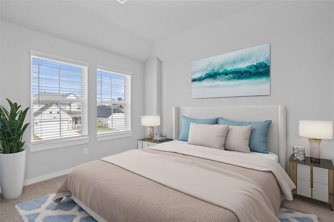 Secondary bedroom features plush carpet, neutral paint and large windows with privacy blinds. | Image 15