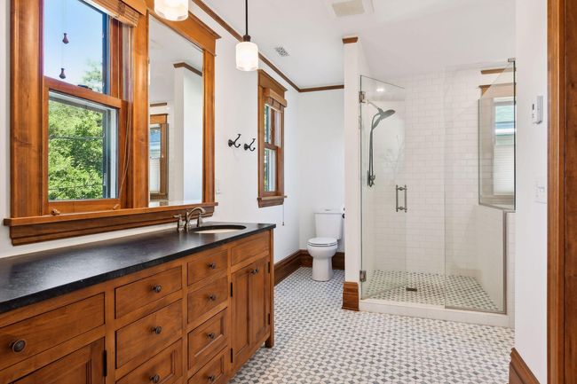 Remodeled second floor full bathroom with heated marble flooring, soapstone counters, and separate tub/walk-in shower. | Image 15