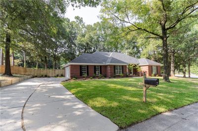 Ranch-style house featuring a front yard | Image 1