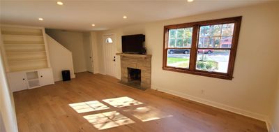 Living room with fireplace and build-in shelves | Image 3