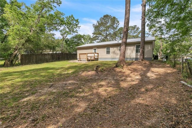 View of yard featuring fence | Image 40