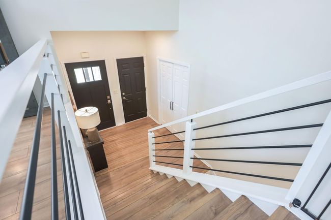 The foyer is large and has a double closet. The updated railings are an excellent modern design. | Image 31