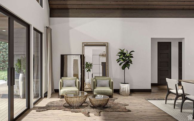 Living area featuring wood finished floors and baseboards | Image 7