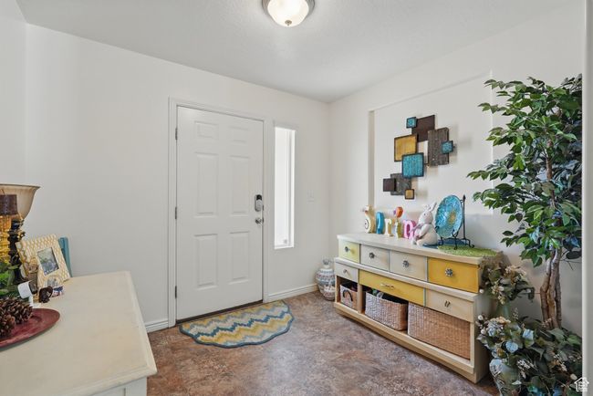 Entryway featuring baseboards and stone finish flooring | Image 8
