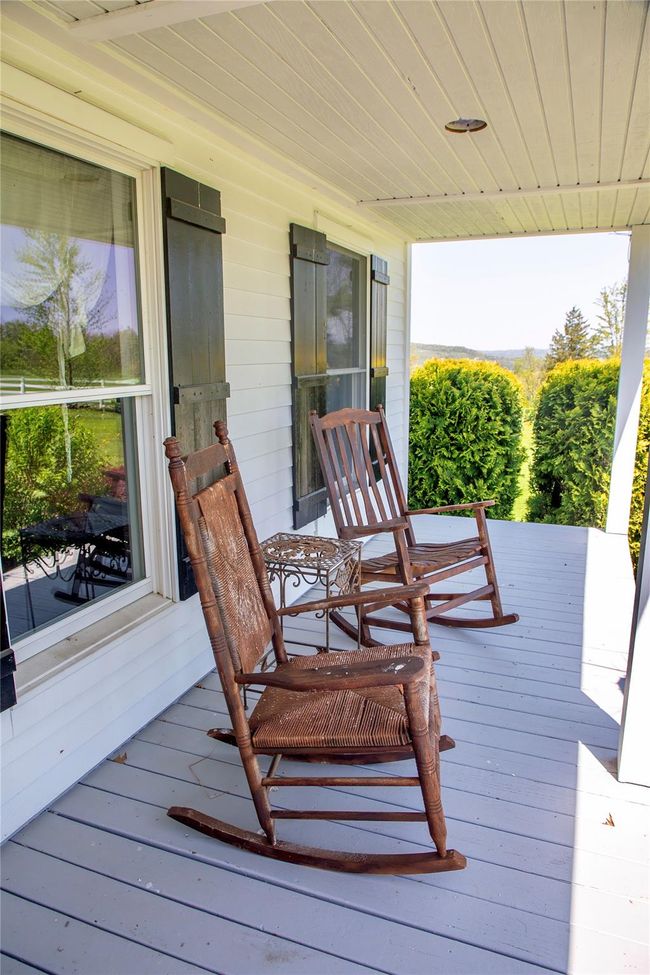 Wooden terrace featuring covered porch | Image 26