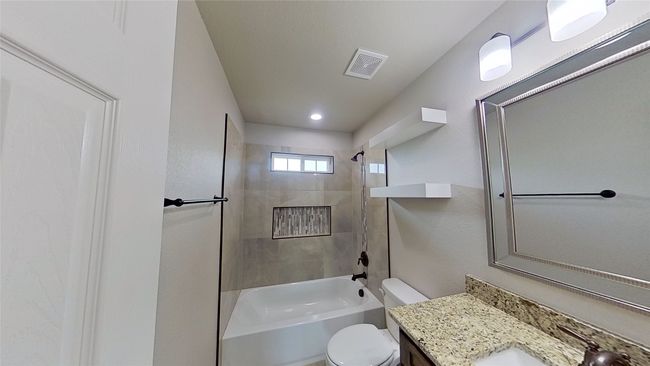 Bathroom featuring toilet, shower / bath combination, visible vents, and vanity | Image 12