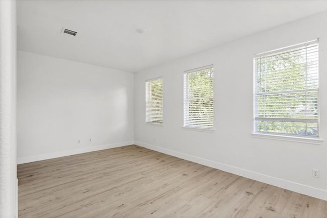 Empty room featuring light wood-style floors and baseboards | Image 15