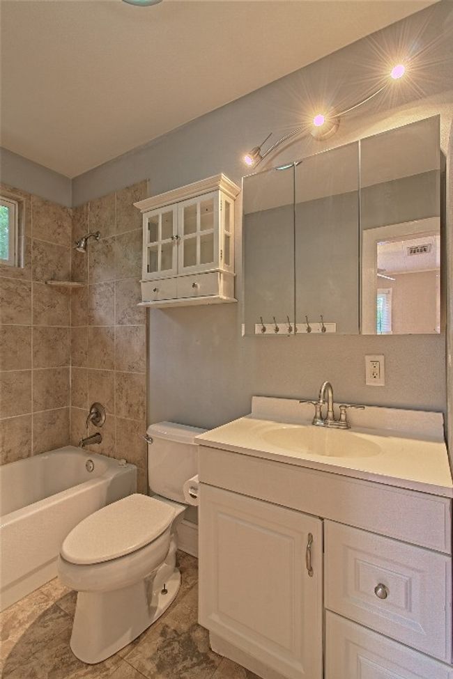 Full bathroom with vanity and shower / tub combination | Image 24