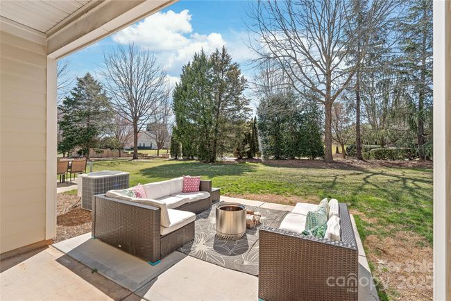 Covered patio with new extended patio. | Image 23