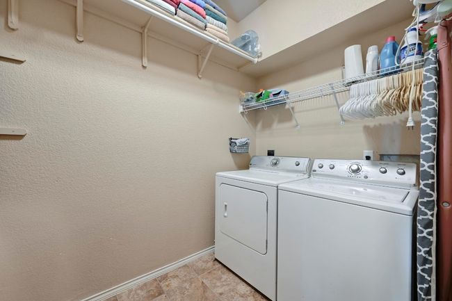 The laundry room includes W/D connections and overhead shelf space for all of your laundry needs PLUS an additional 2nd pantry area. | Image 10