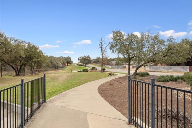 Surrounding community featuring a lawn and fence | Image 39