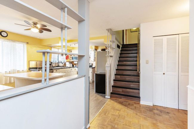 Staircase featuring a ceiling fan | Image 10