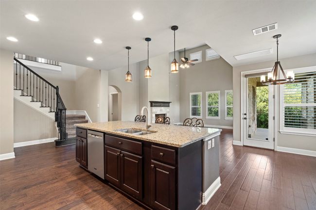 Kitchen with stainless steel dishwasher, and large center island | Image 9