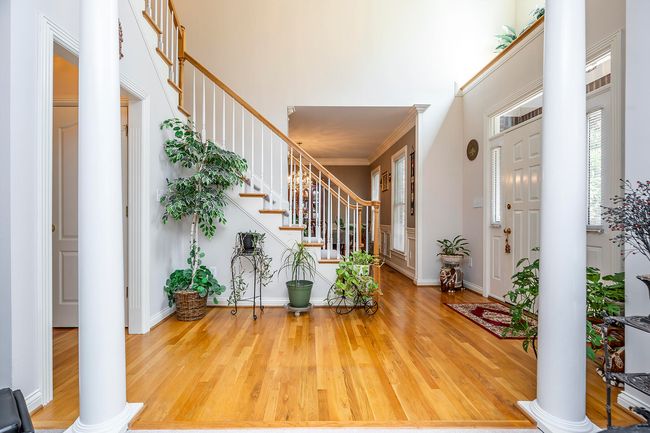 Hardwood Floors & Dual Staircase | Image 10