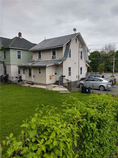 Back of house with a lawn | Image 3