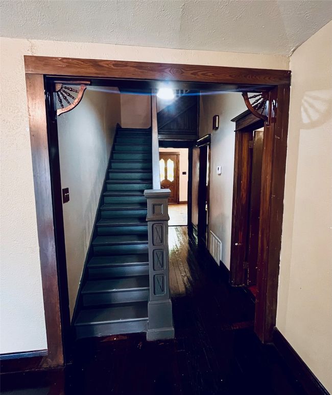 antique wood features leading to the stairs and hall | Image 8