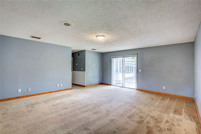 Spare room with carpet, a textured ceiling, and baseboards | Image 14